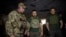 Ukrainians President Volodymyr Zelenskiy (center) visits members of his military's Special Operation Forces near Bakhmut on July 29. 