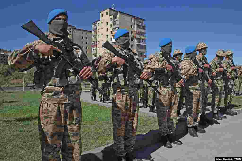 Azerbaijani servicemen during a parade in Susa/Shushi on September 27. In a speech, Azerbaijan&rsquo;s authoritarian president referred to the 2020 fighting, in which vast tracts of Azerbaijani land was retaken from ethnic Armenian fighters, as a &ldquo;holy war&rdquo; and declared, &ldquo;From now on, we will live as a victorious country, a victorious people, and we will build and restore the liberated lands.&rdquo; &nbsp;