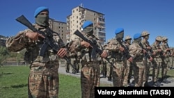 Azerbaijani servicemen take part in a parade in Susa/Shushi on September 27. 