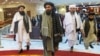 Mullah Abdul Ghani Baradar (center), the Taliban's deputy leader and negotiator, and other delegation members attend the Afghan peace conference in Moscow in March.