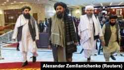 Mullah Abdul Ghani Baradar (center), the Taliban's deputy leader and negotiator, and other delegation members attend the Afghan peace conference in Moscow in March.