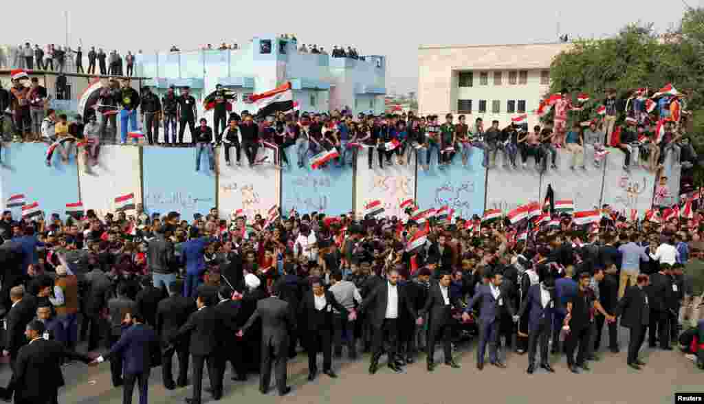 Supporters of prominent Iraqi Shi'ite cleric Muqtada al-Sadr shout slogans during a protest against government corruption outside the Green Zone in Baghdad. (Reuters/Ahmed Saad)