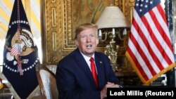 U.S. President Donald Trump speaks to the media after participating in a video teleconference with members of the U.S. military at Trump's Mar-a-Lago resort in Palm Beach, Florida, U.S., December 24, 2019