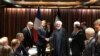 French President Emmanuel Macron shakes hands with Iranian President Hassan Rohani during their meeting on the sidelines of the United Nations General Assembly in New York, September 23, 2019