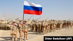 Russian troops line up before the start of joint military drills with Tajikistan and Uzbekistan north of the Tajik border with Afghanistan on August 10. 