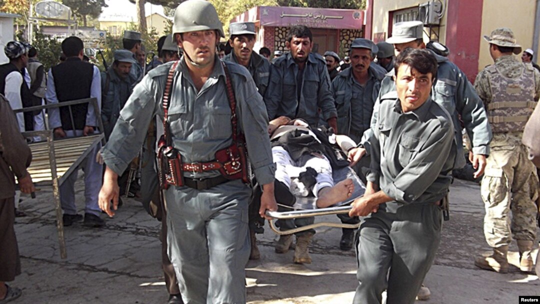 Afghan policemen carry the body of a civilian victim of a bomb blast -- is a continuation of strife and violence the only possible future for Afghanistan.