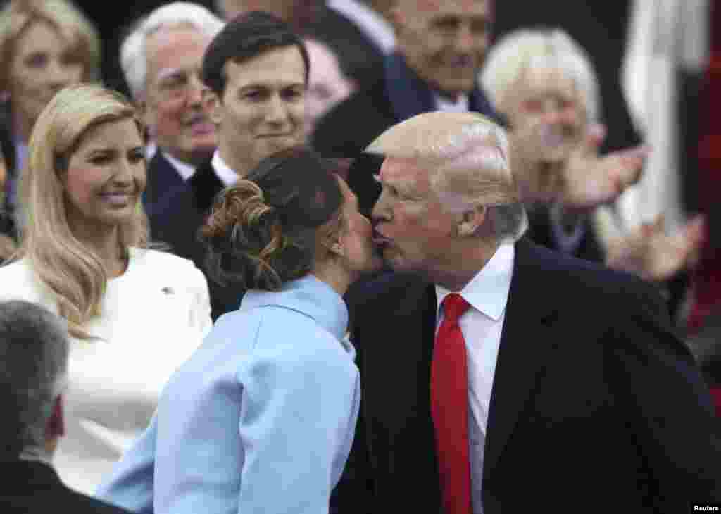 U.S. -- U.S. President-elect Donald Trump kisses his wife Melania as he attends his inauguration ceremonies on the Capitol in Washington, U.S., January 20, 2017.