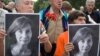 People hold portraits of journalist and human rights activist Natalya Estemirova during a rally in Moscow in July 2009. 