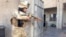 An Iraqi security forces member takes his position with his weapon during clashes with Al-Qaeda-linked militants in the city of Ramadi on February 11.