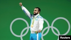 Nijat Rahimov celebrates winning a gold medal at the 2016 Olympics in Rio de Janeiro. 