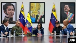 Venezuela's acting president, Delcy Rodriguez (center), speaks with defense chief Vladimir Padrino (second from left) and other officials on January 4.