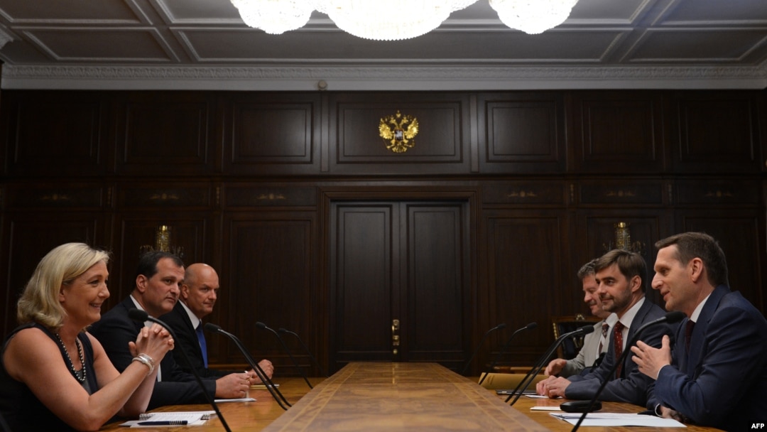 Russian parliament speaker Sergei Naryshkin (front right) meets with France's National Front leader Marine Le Pen (left) in Moscow last week. Analysts say the Kremlin and France's far-right share a similar ideological model based on an aggressive anti-U.S, Euroskeptic attitude. 