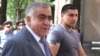 Armenia -- President Serzh Sarkisian's brother Aleksandr (L) is seen outside the parliament building in Yerevan, June 10, 2010.