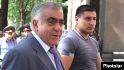 Armenia -- President Serzh Sarkisian's brother Aleksandr (L) is seen outside the parliament building in Yerevan, June 10, 2010.