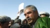 General Abdul Rashid Dostum greets supporters in the Sheberghan region during the 2004 Afghan presidential election.