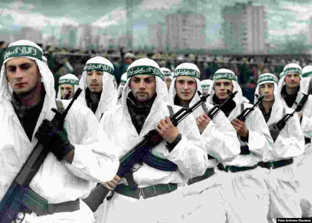 A Muslim brigade of the Bosnian Army marches in a parade in Zenica in 1995. &nbsp; Bin Laden is also widely believed to have been involved in helping channel foreign jihadists to fight alongside Bosnian Muslims during the wars in the 1990s in former Yugoslavia. The foreign Islamist fighters were notorious for their brutality. &nbsp;