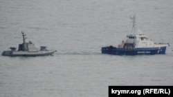 Ukrainian ships are seen being towed out of Kerch on November 17.