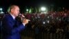 Turkish President Recep Tayyip Erdogan addresses people gathered at the Presidential Complex to protest the July 15th failed military coup attempt in Ankara, on August 10.