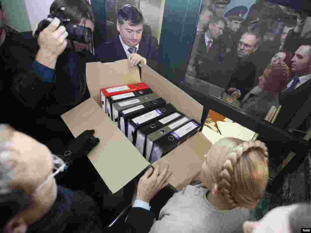 Prime Minister Yulia Tymoshenko and deputies from her bloc submit boxes of documents supporting their allegations of fraud in Ukraine's presidential election to the Supreme Administrative Court in Kyiv in February 2010.
