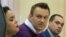 Aleksei Navalny (center) looks on during a court hearing in Kirov on December 5.