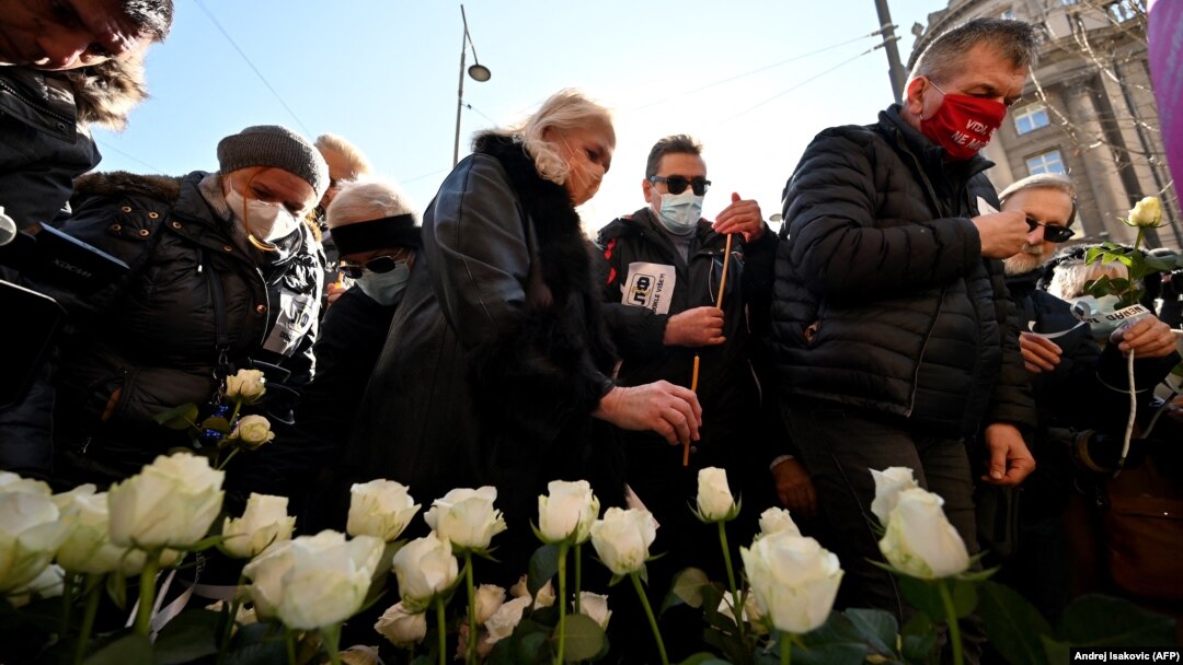 People gather in Belgrade to remember the medical staff who have lost their lives to COVID-19.