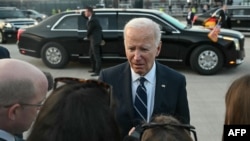 Germany - US President Joe Biden speaks to journalists before boarding Air Force One at Berlin-Brandenburg Airport, October 18, 2024.