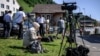Journalists set up near the Burgenstock luxury hotel complex above Lake Lucerne on June 19.