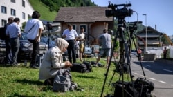 Journalists set up near the Burgenstock luxury hotel complex above Lake Lucerne on June 19.