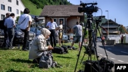 Journalists set up near the Burgenstock luxury hotel complex above Lake Lucerne on June 19.