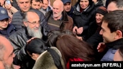 Armenia - Archbishop Mikael Ajapahian is greeted by supporters in Gyumri, February17, 2026.