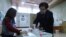 Armenia - A woman at a polling station in Yerevan votes in Armenian parliamentary elections, December 9, 2018.
