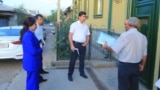 Officials visit people's homes in the city of Bokhtar as part of the Door-To-Door campaign.