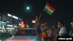 Курды в Ираке празднуют после объявления результатов рефрендума. Эрбиль, 25 сентября 2017 года.