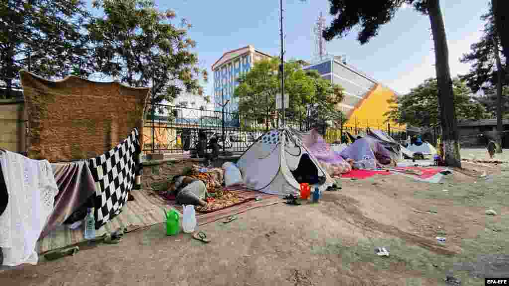 Internally displaced Afghan families in tents at a park in Kabul on August 18. The Taliban has demanded civilians hand over all government property, including weapons. &nbsp;