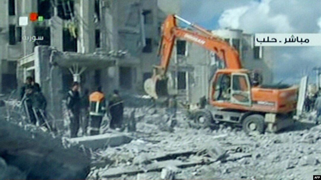 Syrian TV shows rescue work at the scene of a blast in the city of Aleppo on February 10.