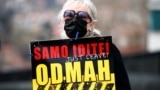 BOSNIA-HERZEGOVINA -- A woman holds a sign during a protest urging the government to obtain coronavirus disease (COVID-19) vaccines, in Sarajevo, April 6, 2021