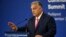 Hungarian Prime Minister Viktor Orban gestures at a press conference on November 7 ahead of the summit in Budapest. 