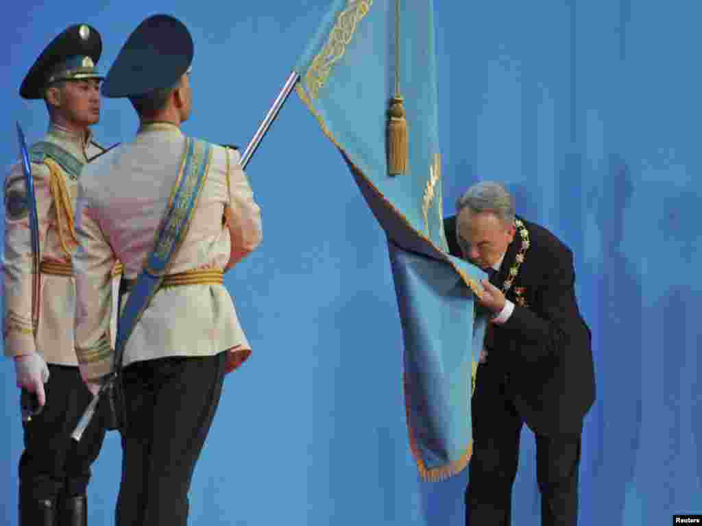 Kazakh President Nursultan Nazarbaev kisses the national flag during his inauguration ceremony in Astana on April 8. The 70-year-old Nazarbaev has led Kazakhstan for more than 20 years. Photo by Mukhtar Kholdorbekov for Reuters