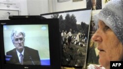 A Bosnian Muslim survivor of the Srebrenica massacre watches a live broadcast in Sarajevo of Hague proceedings against Karadzic in August 2008.