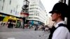 A police officer stands by a cordoned-off area on London's Leicester Square on August 12.