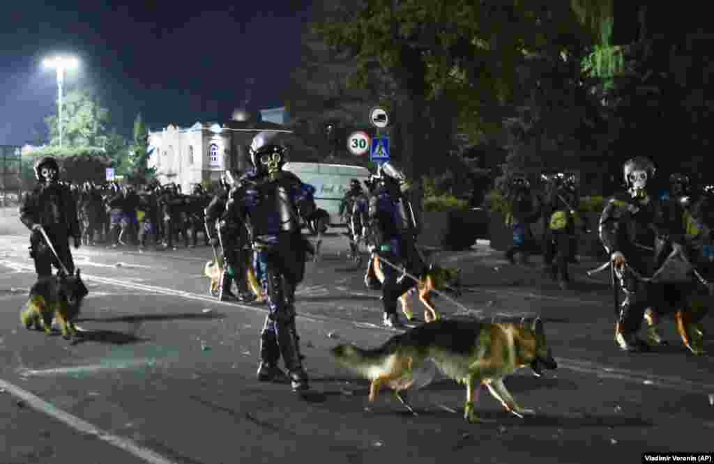 Riot police disperse protesters in Bishkek.