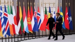 French President Emmanuel Macron (left) and Ukrainian President Volodymyr Zelenskyy walk together to chair a pervious meeting of the so-called Coalition of the Willing at the Elysee presidential palace in Paris in September.