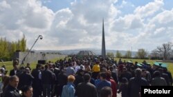 People walk to the Tsitsernakabert memorial in Yerevan on April 24 during an annual commemoration of the 1915 mass killings of Armenians in Ottoman Turkey. 