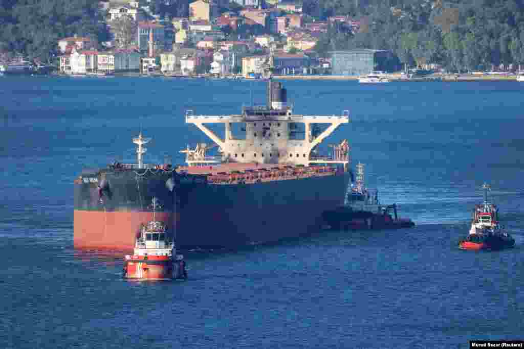 The Liberian-flagged bulk carrier Great Ocean, showing damage from an apparent drone strike, is towed through the Bosphorus on August 20.<br><br>Alexa said the list of apparent targets has recently expanded "from tankers to dry-cargo vessels," and the danger for seamen has intensified. Aerial drone strikes targeting accommodation blocks, he said, “were rare before [Ukraine's Operation Molochka]. He added that "Russia has responded in kind, but with fewer merchant ships available as targets it has concentrated more on ports."