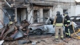 Emergency workers at the site of a Russian strike on Zaporizhzhya, Ukraine, on September 22.