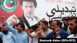 Supporters of Imran Khan, head of Pakistan Tehreek-e Insaf (PTI) celebrate in Karachi as the National assembly (lower house of the parliament) elects Imran Khan, as the Prime Minister in Islamabad after on August 17.