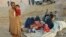 An Afghan family waits for help from the government and aid organizations in the northern Takhar province after fleeing their homes in neighboring Kunduz province in October.