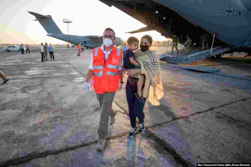 Evacuees from Afghanistan arrive in Tashkent, Uzbekistan, on August 17.