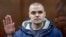 Russian protester Sergei Surovtsev, 30, was sentenced to 2 1/2 years in a penal colony for assaulting an officer during an anti-government rally in Moscow on July 27, 2019.