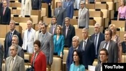 Duma deputies standing for the hymn on June 11.